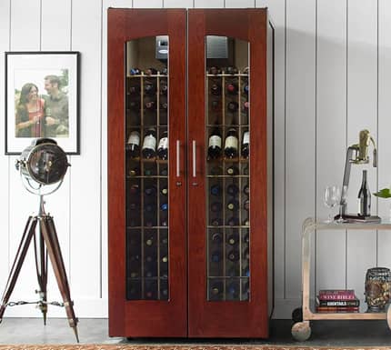 Wine cabinet filled with bottles in a luxurious home